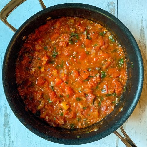 Shrimp Saganaki - Delicious Shrimp in a tomato sauce and covered in feta!